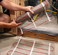 Flip the floor heating mat over to begin another row.