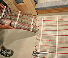 Space the cable and run another row with the floor heating mat.