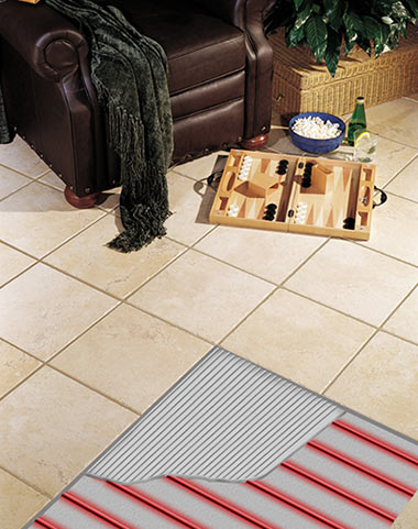 Heated tile floor with cutaway, showing illustration of heat cable and thinset. Heated tile floor with cutaway, showing illustration of heat cable and thinset.